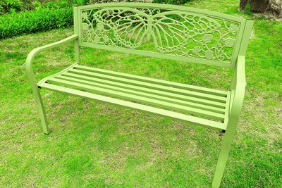 Creating a Relaxation Spot with a Butterfly Metal Bench and Soft Garden Touches