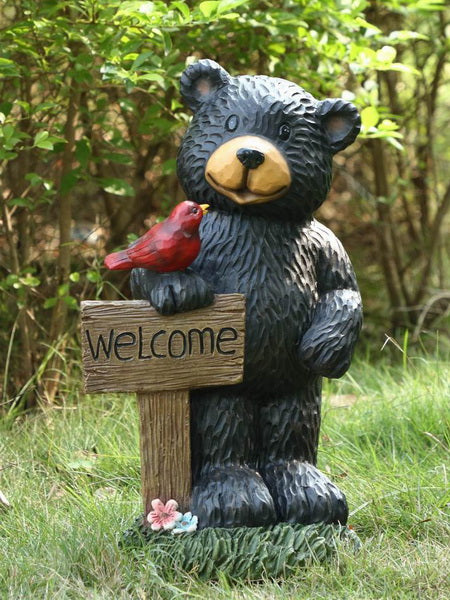Black Bear Holding Welcome Sign with Red Sparrow Statue HI-LINE GIFT LTD.