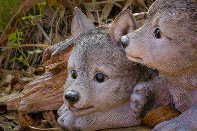 Gray Wolf Cubs Hiding under Log Statue HI-LINE GIFT LTD.
